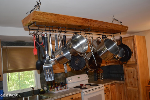 292 Well Rd, Greeley, PA 18425 - kitchen featuring electric stove and decorative backsplash