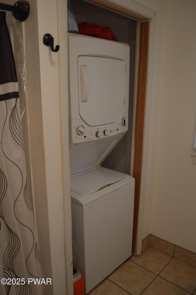 292 Well Rd, Greeley, PA 18425 - laundry room featuring stacked washer and clothes dryer and light tile patterned floors