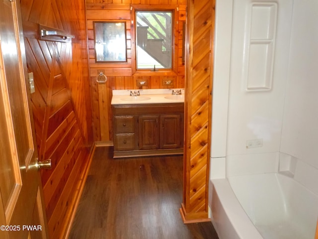 59 Tobyhanna Rd, Gouldsboro, PA 18424 - full bath featuring wood finished floors, double vanity, and wood walls