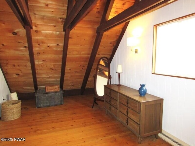 interior space with a baseboard heating unit, lofted ceiling with beams, wooden ceiling, and light wood-style floors