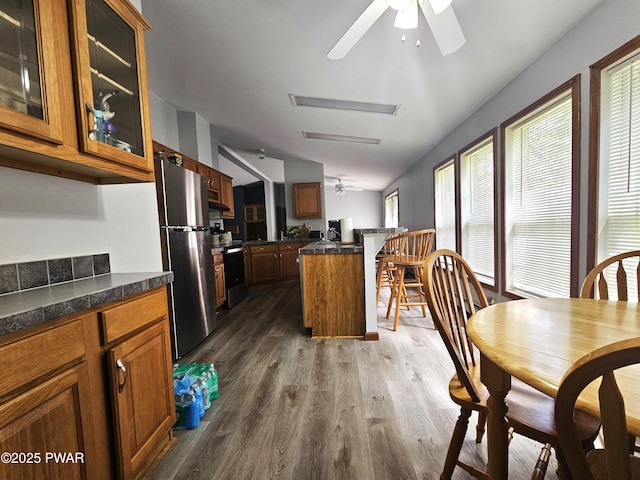 115 Deer Path, Tafton, PA 18464 - kitchen with ceiling fan, freestanding refrigerator, brown cabinets, and vaulted ceiling