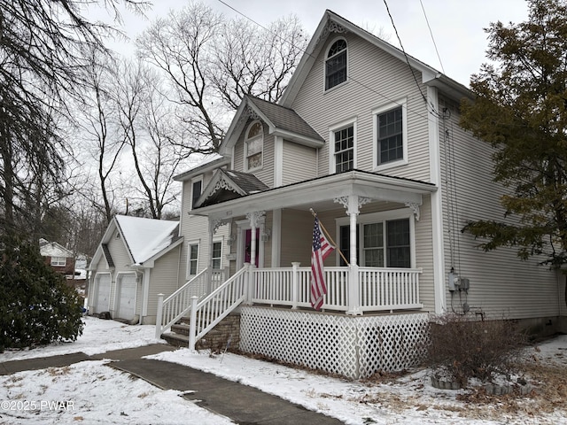 view of front facade featuring a porch and a garage