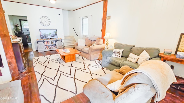 living room featuring hardwood / wood-style flooring and ornamental molding