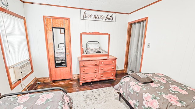 bedroom with wooden walls and ornamental molding