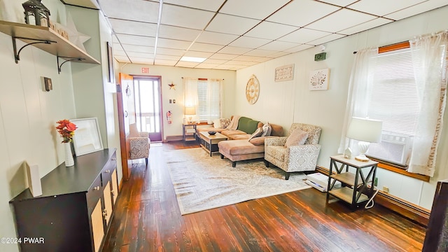 living room featuring cooling unit and dark wood-type flooring