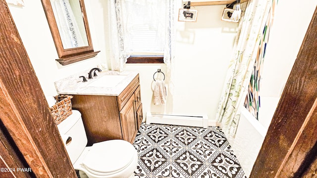 full bathroom featuring vanity, shower / bath combo, tile patterned flooring, toilet, and baseboard heating