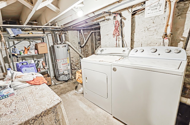 clothes washing area with independent washer and dryer and gas water heater