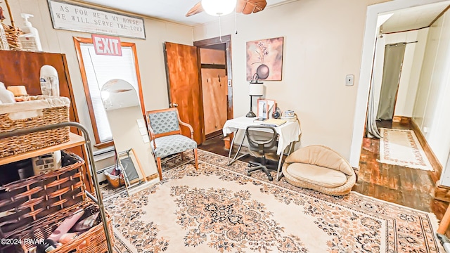 sitting room featuring hardwood / wood-style flooring and ceiling fan