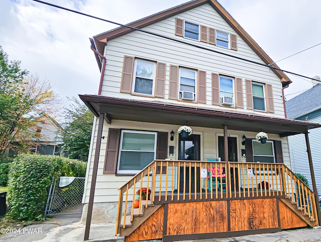 view of front of house with cooling unit and covered porch