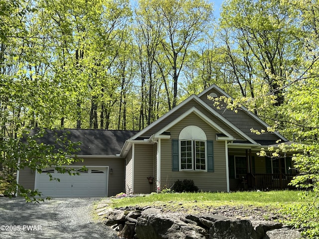 111 Bluestone Dr, Lords Valley, PA 18428 - view of front of property featuring a garage, covered porch, and driveway
