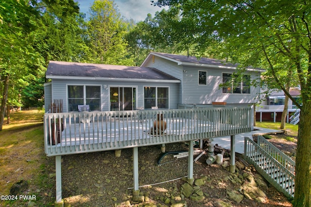 rear view of property with a deck