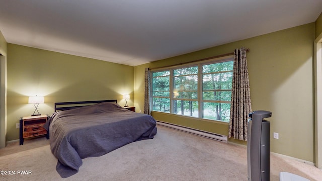 carpeted bedroom with baseboard heating