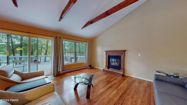 living room featuring beam ceiling, high vaulted ceiling, light hardwood / wood-style floors, and a baseboard heating unit