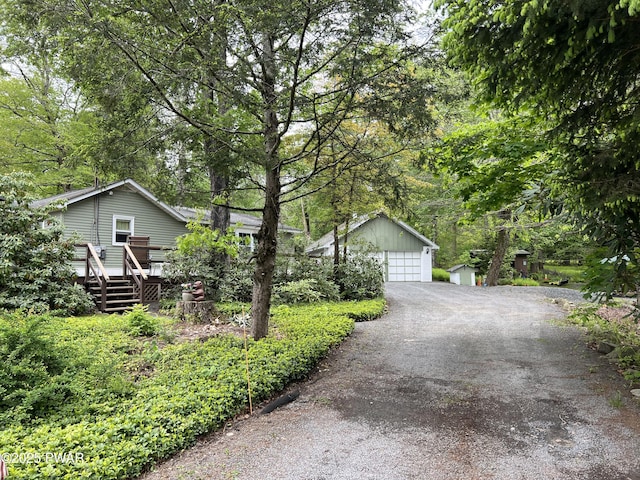 58 Branch Rd, Greentown, PA 18426 - view of front of property with an outdoor structure, a wooden deck, and a detached garage