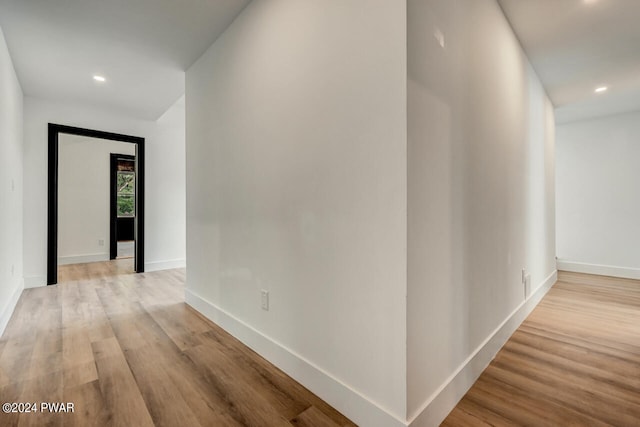 hall with light hardwood / wood-style floors