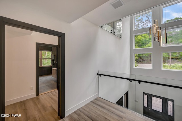 stairway with hardwood / wood-style flooring