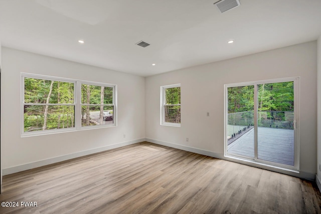 unfurnished room featuring light wood-type flooring