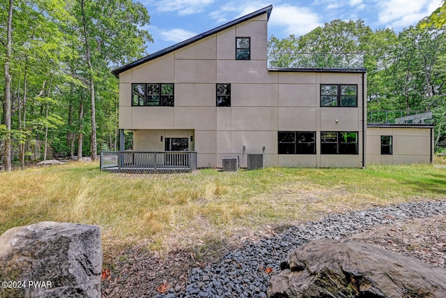 rear view of property with central air condition unit