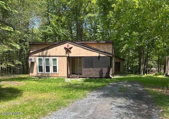 94 Cedarwood Ter, Lake Ariel, PA 18436 - view of front of house with dirt driveway and a front yard