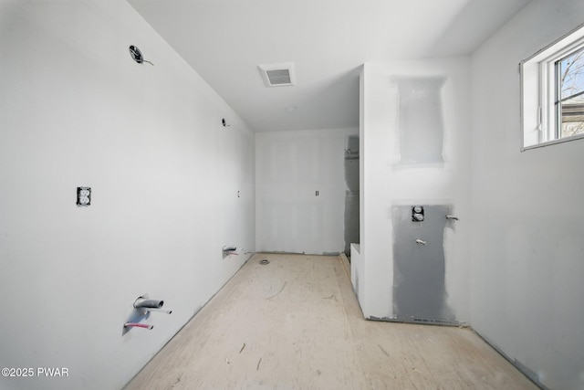 bathroom featuring visible vents and wood finished floors