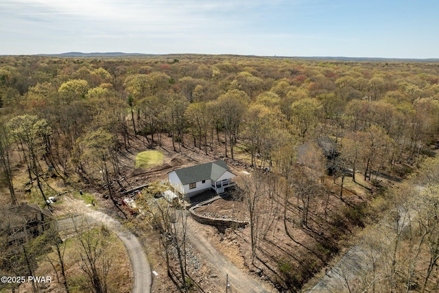bird's eye view featuring a forest view