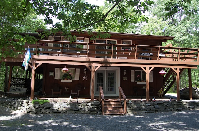 view of front of property featuring a wooden deck and french doors