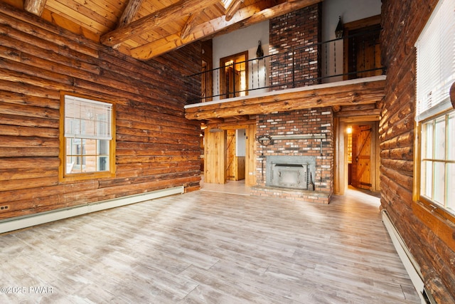 unfurnished living room featuring beamed ceiling, wood ceiling, rustic walls, and high vaulted ceiling