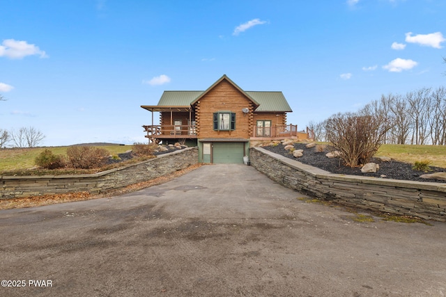 log cabin featuring a garage