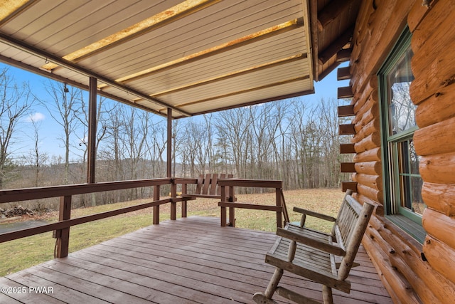 wooden deck featuring a yard