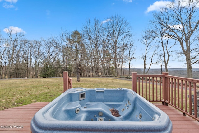 deck with a lawn and a hot tub