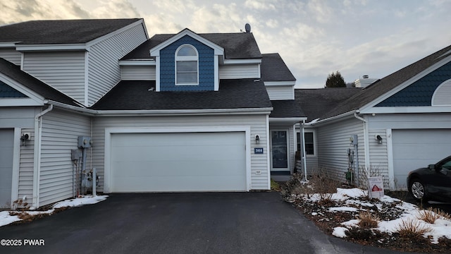 view of front of property with a garage