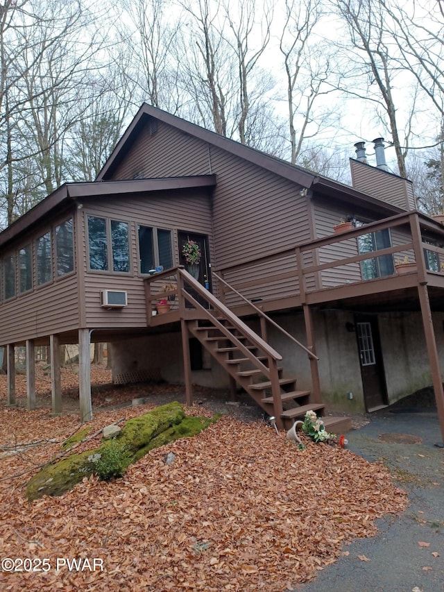 view of front facade with a wooden deck