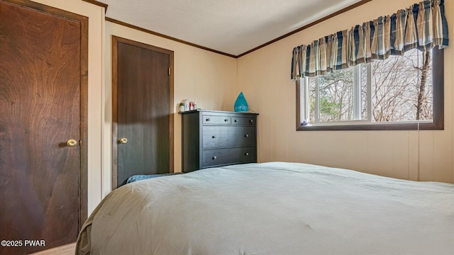 bedroom with crown molding