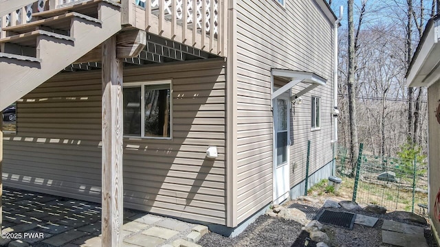 view of side of property with a balcony