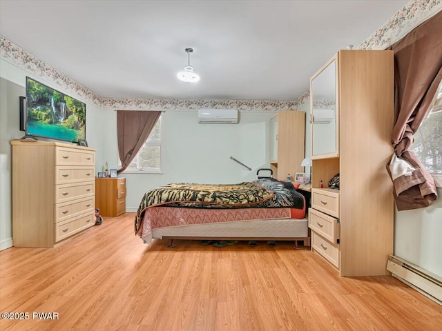 6 Ridge Vw, Hawley, PA 18428 - bedroom featuring a baseboard heating unit, light wood-style flooring, and a wall unit AC