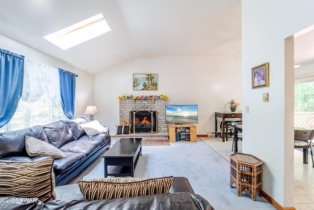 111 Babette Ct, Dingmans Ferry, PA 18328 - living room with a skylight, lofted ceiling, a fireplace, and light colored carpet