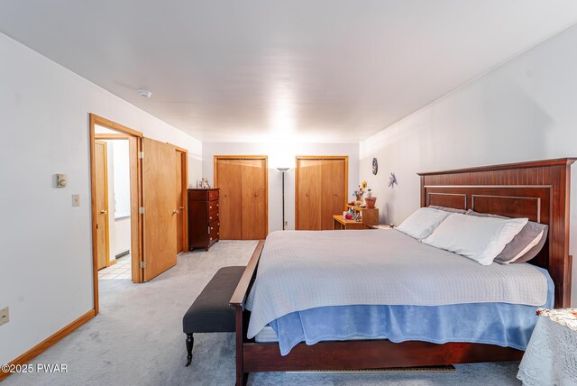 111 Babette Ct, Dingmans Ferry, PA 18328 - bedroom with light carpet, multiple closets, and baseboards