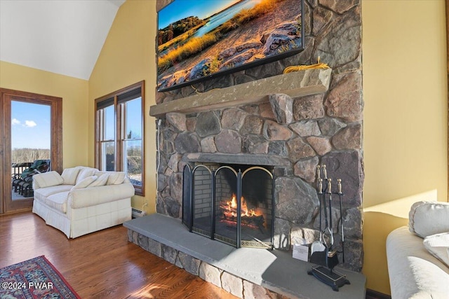 1075 Owego Tpke, Honesdale, PA 18431 - living room featuring wood finished floors, a fireplace, and high vaulted ceiling