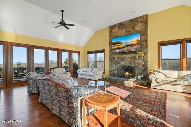 1075 Owego Tpke, Honesdale, PA 18431 - living room featuring high vaulted ceiling, a stone fireplace, a ceiling fan, and dark wood finished floors