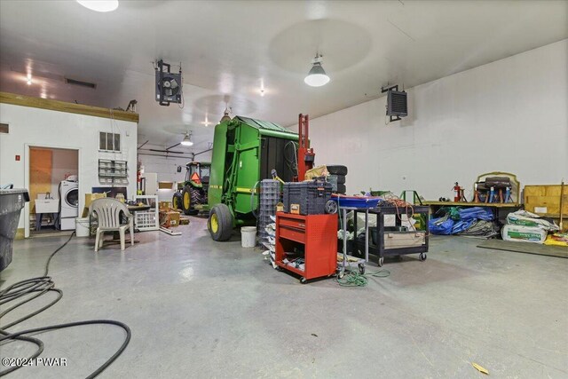 1075 Owego Tpke, Honesdale, PA 18431 - garage with washer / dryer, a heating unit, and a workshop area