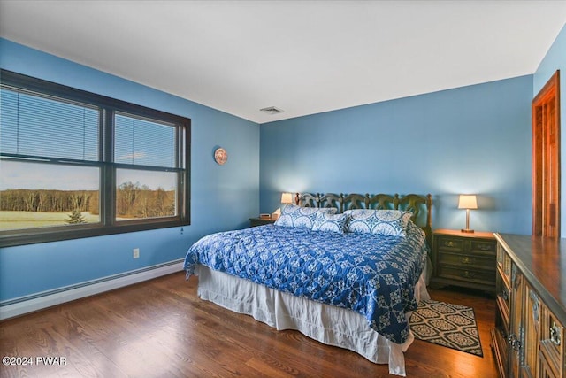 1075 Owego Tpke, Honesdale, PA 18431 - bedroom featuring a baseboard heating unit and wood finished floors