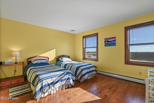 1075 Owego Tpke, Honesdale, PA 18431 - bedroom with a baseboard radiator, multiple windows, and wood finished floors
