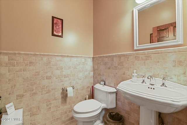 1075 Owego Tpke, Honesdale, PA 18431 - half bathroom featuring wainscoting and tile walls