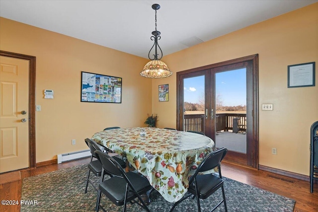 1075 Owego Tpke, Honesdale, PA 18431 - dining area with french doors, baseboard heating, and dark wood-type flooring