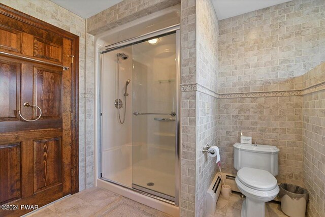 1075 Owego Tpke, Honesdale, PA 18431 - full bath featuring a shower stall, tile patterned flooring, and tile walls