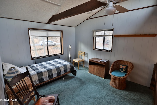 bedroom with ceiling fan, vaulted ceiling with beams, a textured ceiling, multiple windows, and carpet