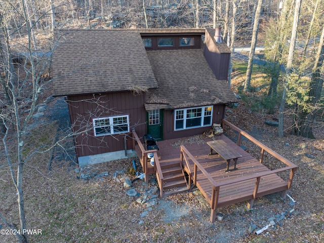 150 N Lake Dr, Dingmans Ferry, PA 18328 - back of property with a shingled roof and a deck