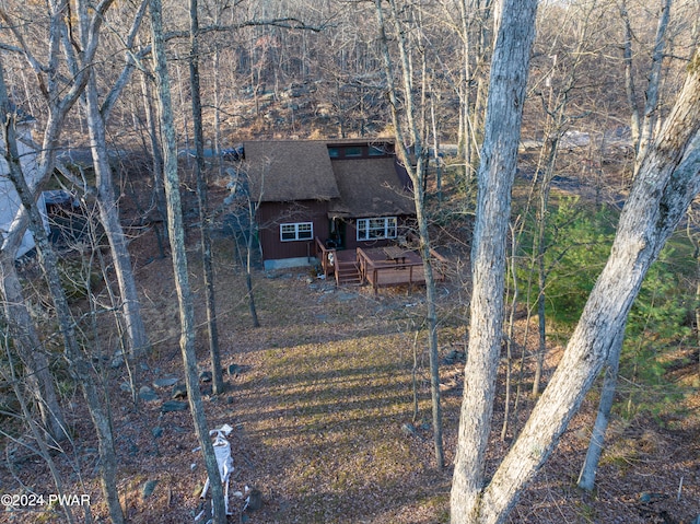 rear view of house featuring a deck