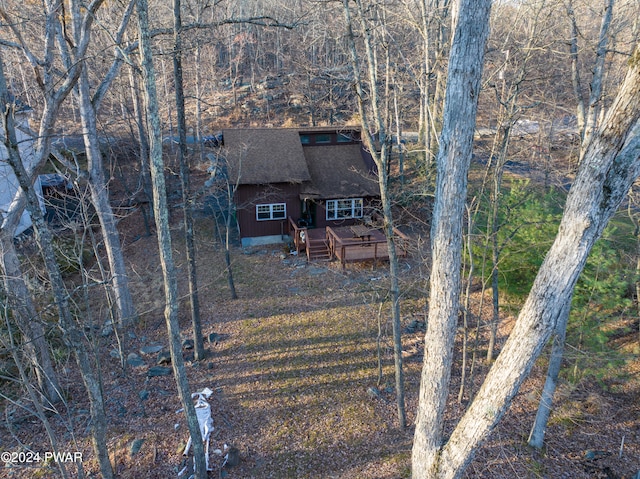 150 N Lake Dr, Dingmans Ferry, PA 18328 - view of front facade featuring a shingled roof and a wooden deck