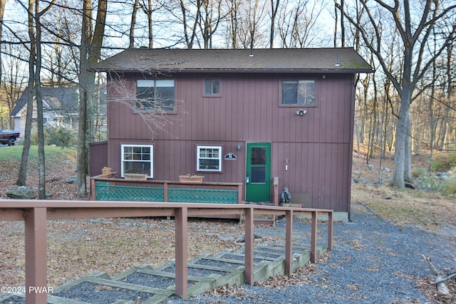 rear view of house featuring a deck